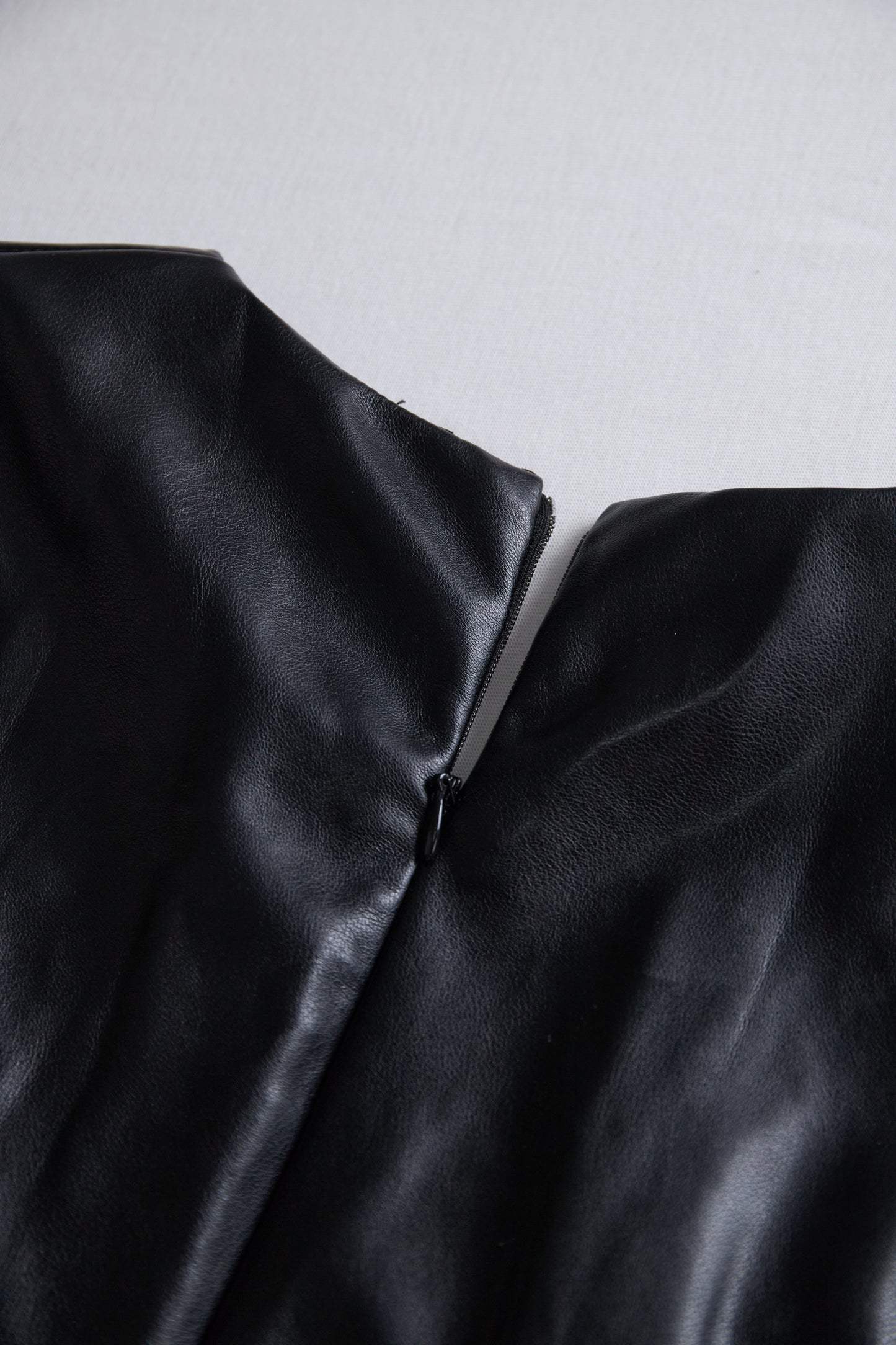 Sleek Black Faux Leather Wrap Mini Dress