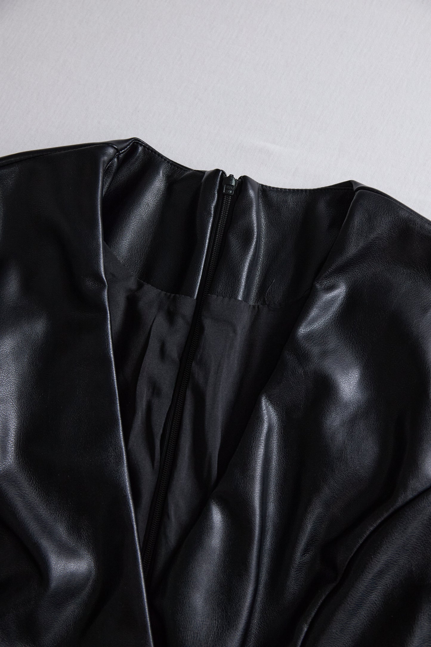 Sleek Black Faux Leather Wrap Mini Dress