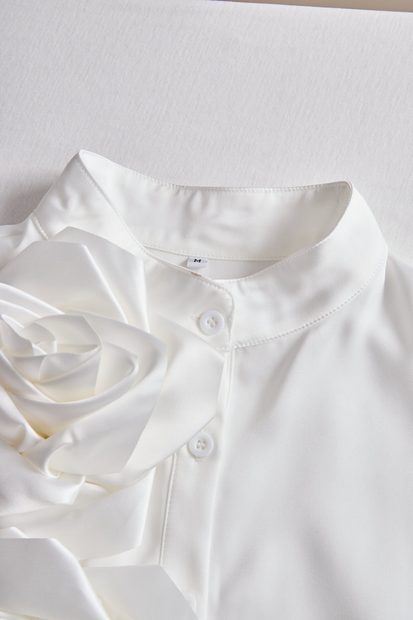 Modern Sleeveless White Blouse with 3D Rose Accents