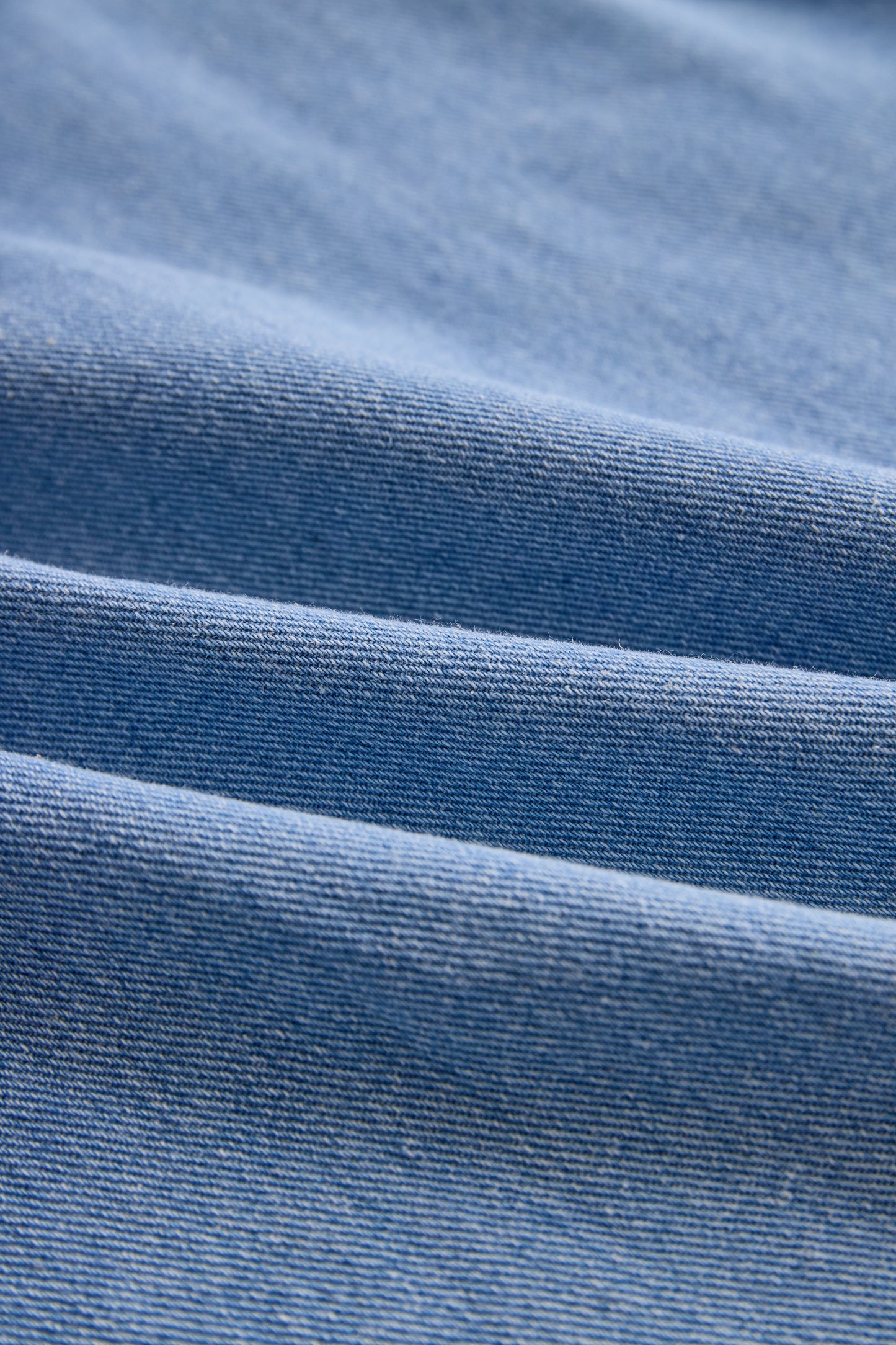 Stylish Denim Two-Piece Set With Asymmetrical Top And Fringed Skirt